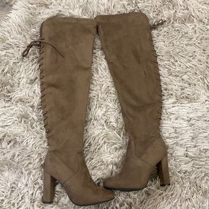 Knee high boots laced in back